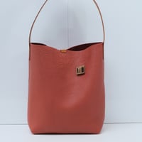 Image 1 of Tube Tote in pebbled warm orange