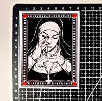 Image 2 of Bad Nun! Nun Sniffing Cocaine Off Of A Pile On Her Wrist Glossy Finish Vinyl Sticker