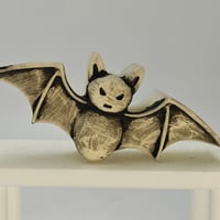 Image 1 of Bat- white to orange/violet glow