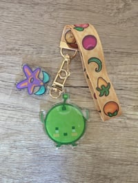 Image 1 of Stardew Valley Crops Wristlet and Junimo Stardrop Charm Keychain Set