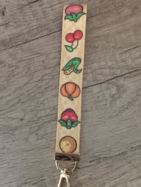 Image 2 of Stardew Valley Crops Wristlet and Junimo Stardrop Charm Keychain Set
