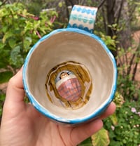 Image 1 of Bedroom Inside a Ceramic Mug