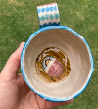 Image 2 of Bedroom Inside a Ceramic Mug
