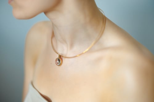 Image of "Bringer of the sun" gold plated silver pendant with rock crystal · SOLIFER ·