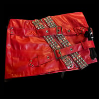 Image 1 of Red faux leather buckle zipper skirt w/ distressed studded strap