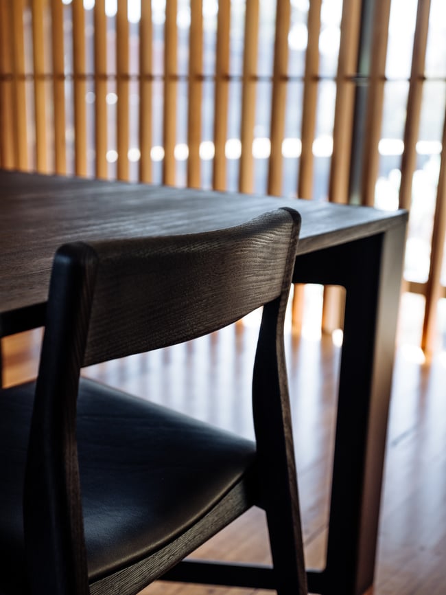 ROSE DINING CHAIR IN TORCHED TASMANIAN OAK WITH AN UPHOLSTERED LEATHER SEAT