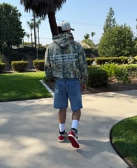 Image 3 of The Weapon May Be Formed Camo Zip Up