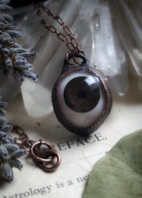 Image 1 of Prosthetic Eye Pendant - Brown