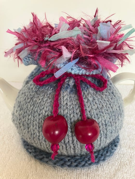 Image of small PALE BLUE Go On! tea cosie