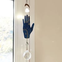 Image 1 of MÓVIL-ATRAPALUZ MANO CÓSMICA