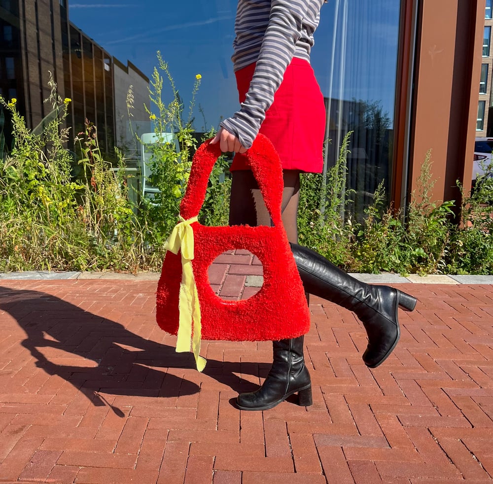 Image of Tufted red bag mirror 