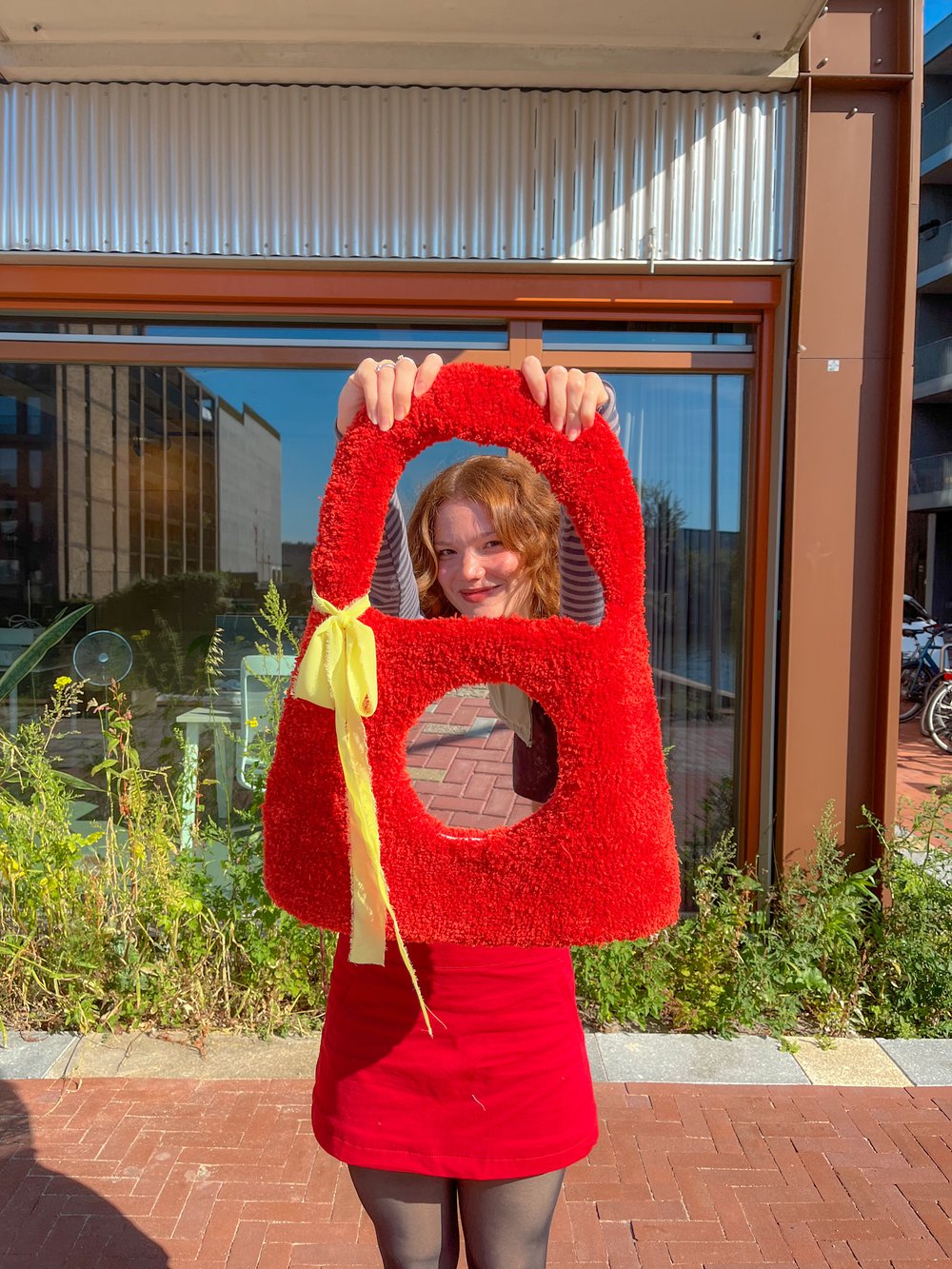 Image of Tufted red bag mirror 
