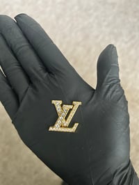 1 x gold metal L.v. charm (10 LEFT TO PURCHASE)