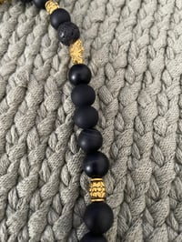 Image 4 of Black and Orange Elastic Beaded Necklace with Heart Charms