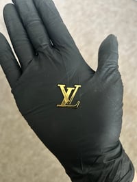 1 x gold metal lv charm (10 LEFT TO PURCHASE)