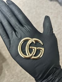 1 x gold gg metal flat back  charm.