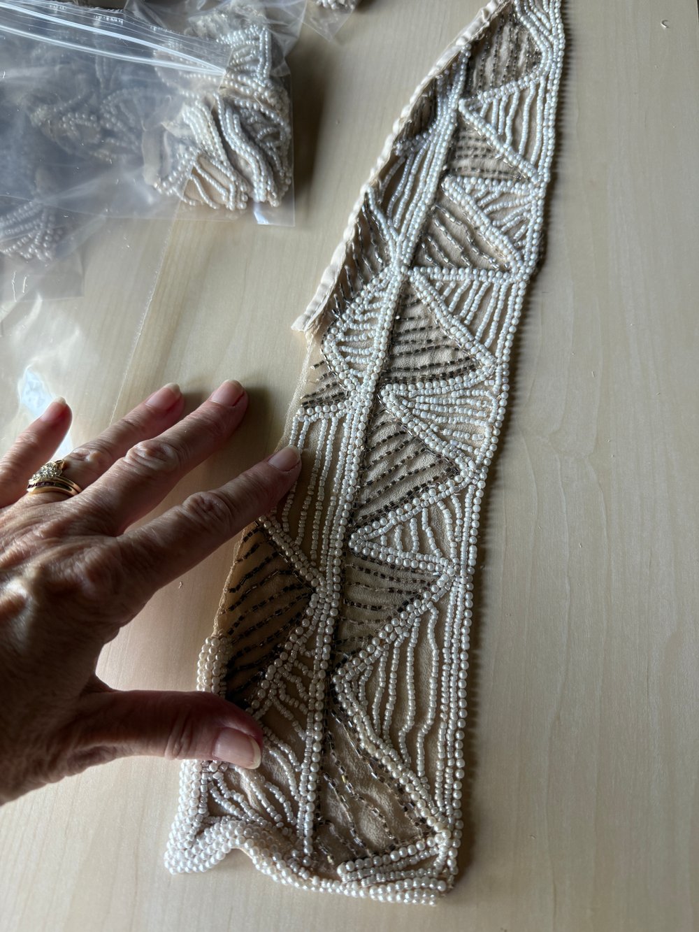 Image of Strip of various beads from dress