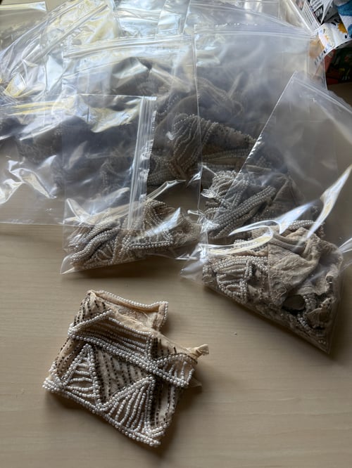 Image of Strip of various beads from dress