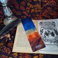 Image 3 of Bookmarks Halloween 2025 Girls - Girl looking at large pumpkin