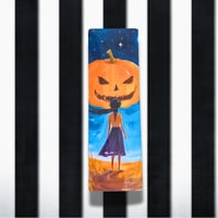 Image 1 of Bookmarks Halloween 2025 Girls - Girl looking at large pumpkin