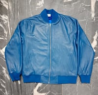 Image 1 of Blue Leather Jacket & Airport Bag