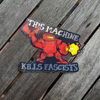 Image 2 of This Machine Kills Fascists Junk Mech - 4 inch Mirrored Foil Sticker