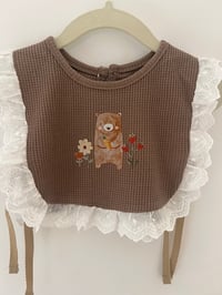Image 1 of Brown Cotton Baby Bib with Bear, flowers and strawberries 🧸