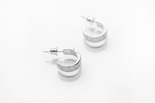 Image of Round silver earrings with inscription in Latin