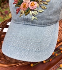 Image 4 of Pink hand embroidered flowers on an adjustable light blue jean hat
