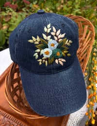 Image 3 of Blue and turquois hand embroidered flowers on an adjustable dark blue jean fabric hat