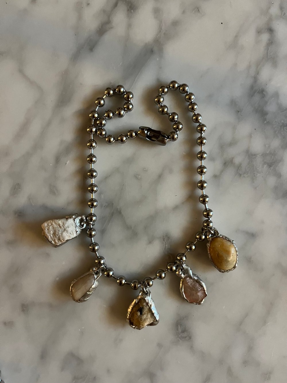 Image of ROSE GROWING OUT OF CONCRETE