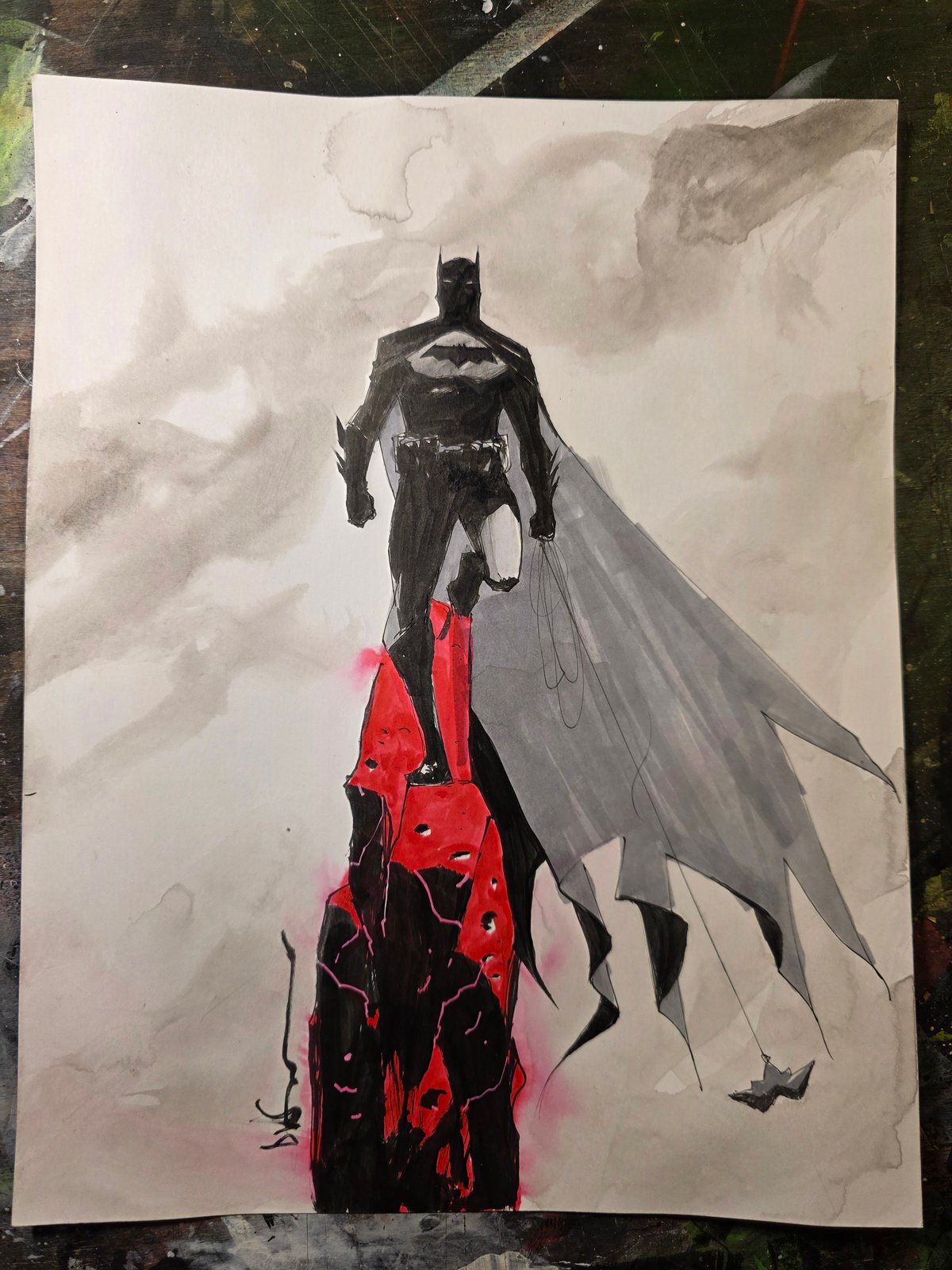 Image of Bat on a red rock