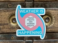 Image 1 of TRANS RIGHTS ARE HUMAN RIGHTS WEATHER IS HAPPENING TRANS LOGO 3" STICKER
