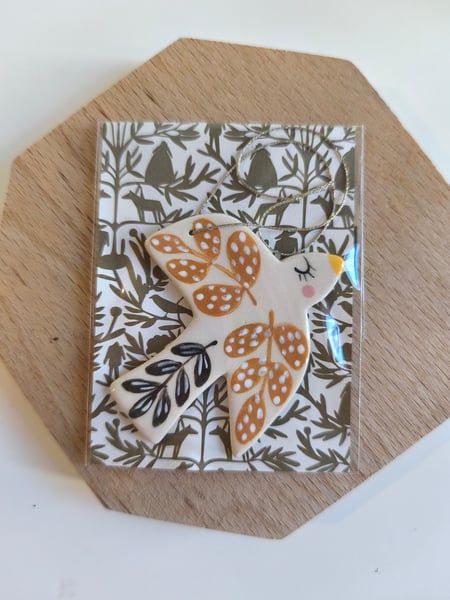 Image of    Petit oiseau à suspendre brun