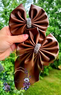 Image 3 of Mystery pleather bows