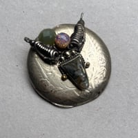 Broche « CAPRICORNE »