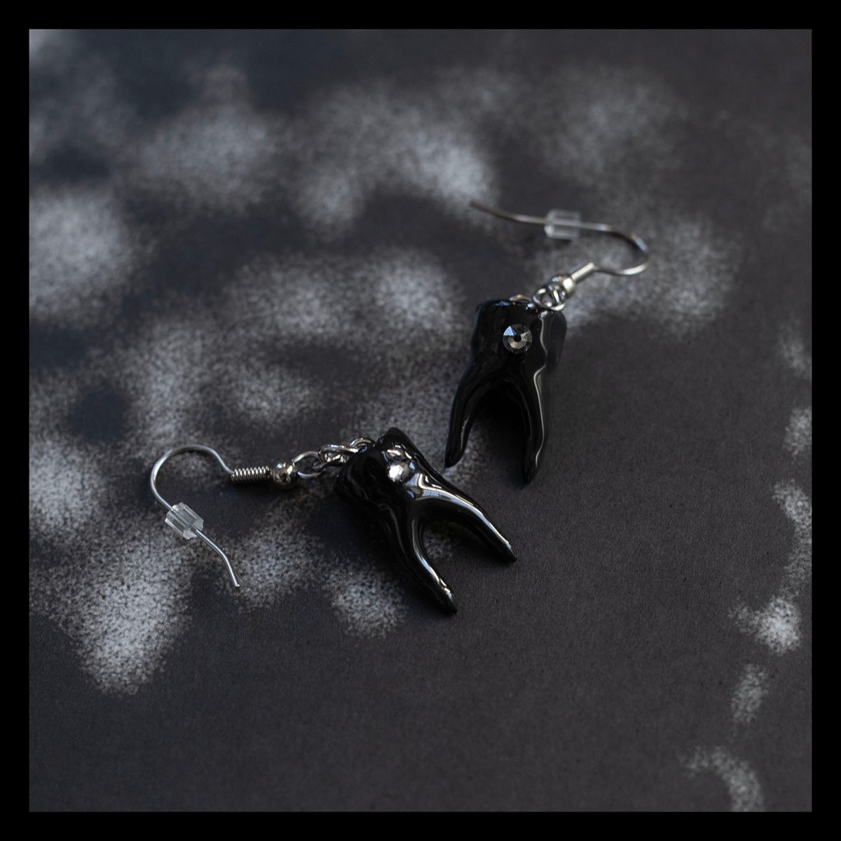 Swarovski tooth gem earrings in glossy black