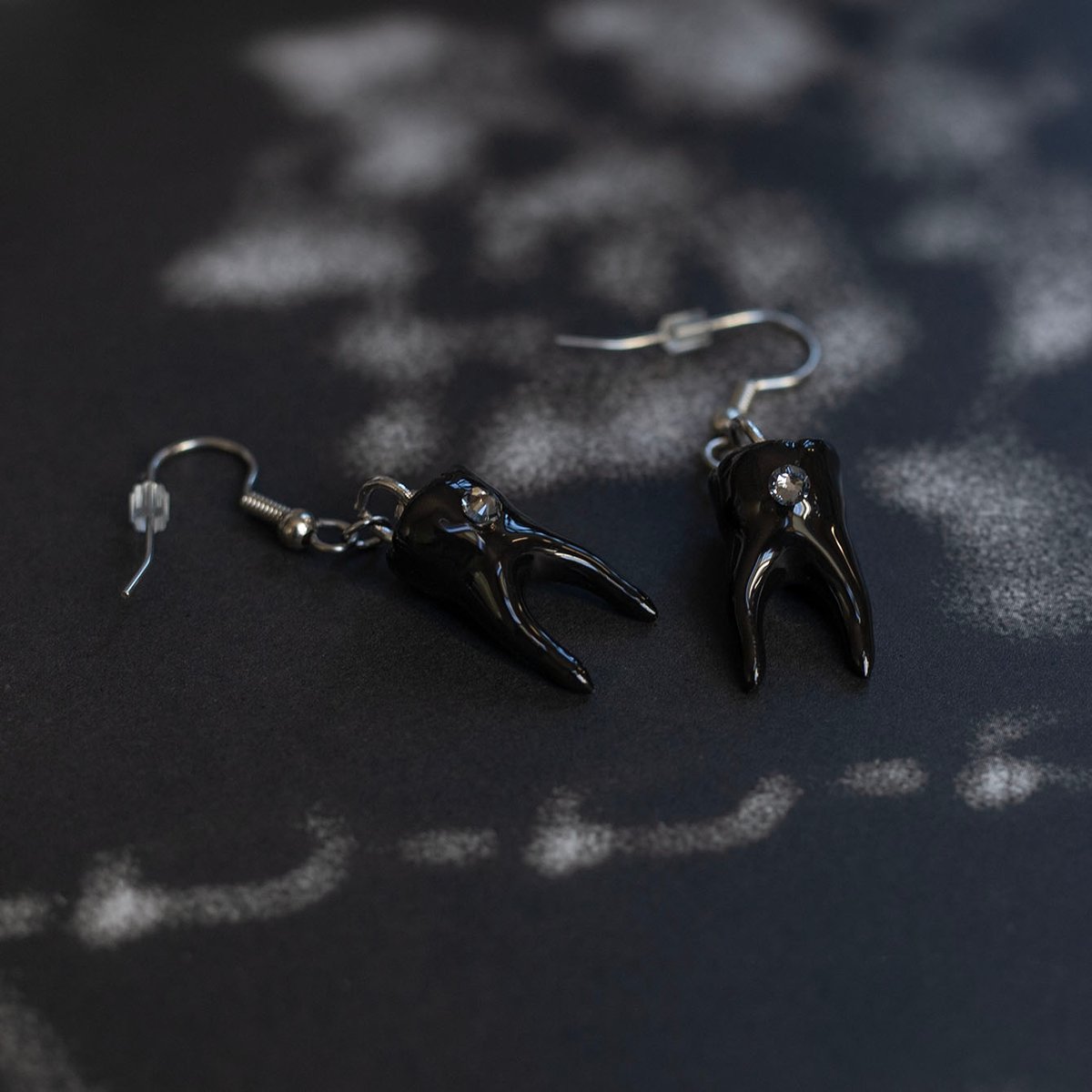 Swarovski tooth gem earrings in glossy black