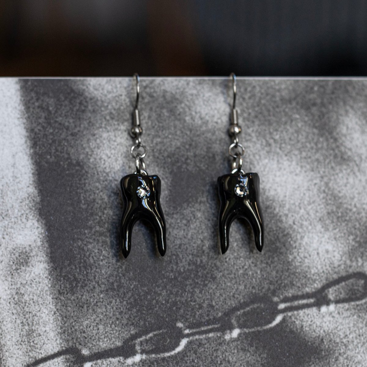 Swarovski tooth gem earrings in glossy black