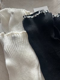 Image 3 of Merino wool black  boat neck top with Pearl buttons in front 