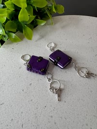 Image 1 of Miniature book and keys dangle earrings; Black or purple
