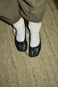 Image 2 of ankle warmers with a strap