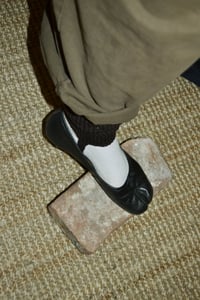 Image 1 of ankle warmers with a strap
