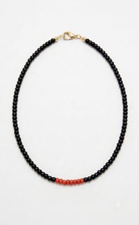 Image 1 of Black Red Puka