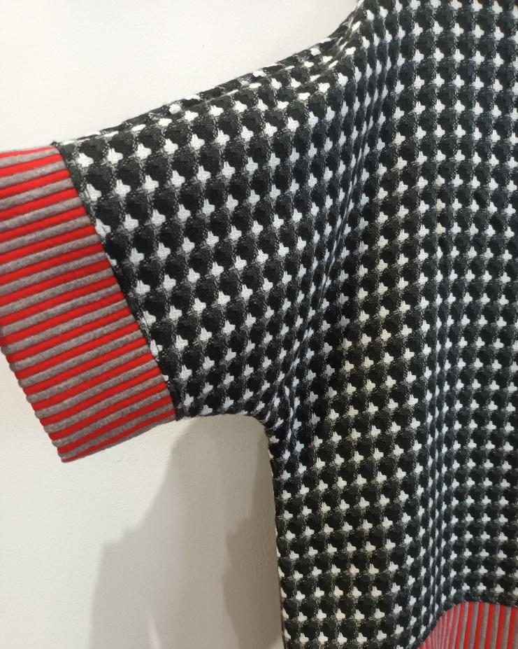 Image of black, red and white color block sweater