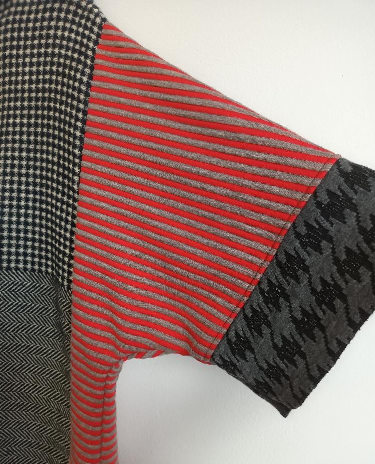 Image of black, red and white color block sweater