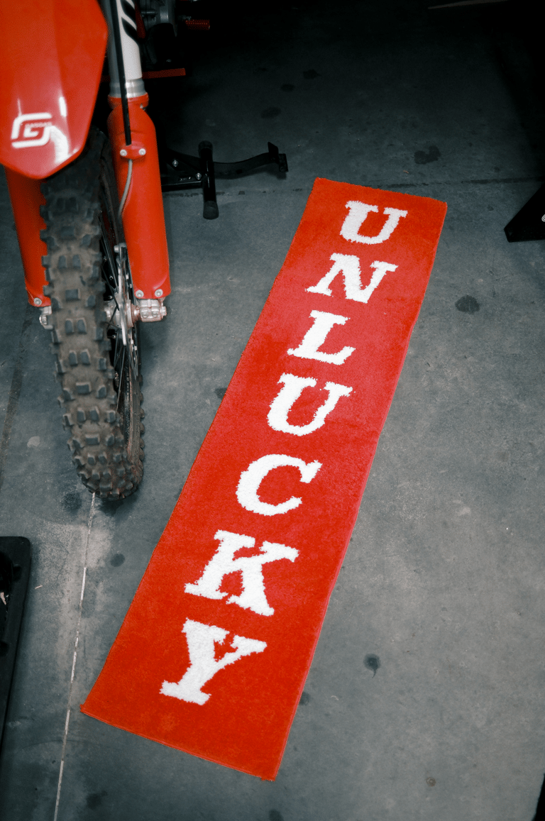 " UNLUCKY " RUNNER RUG - RED/WHITE
