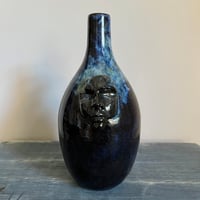 Image 1 of vases with faces iv