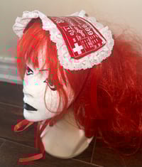 Image 1 of medical monitor print headdress (red x white)
