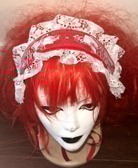 Image 1 of "mutilation is salvation" print headdress (red x white)